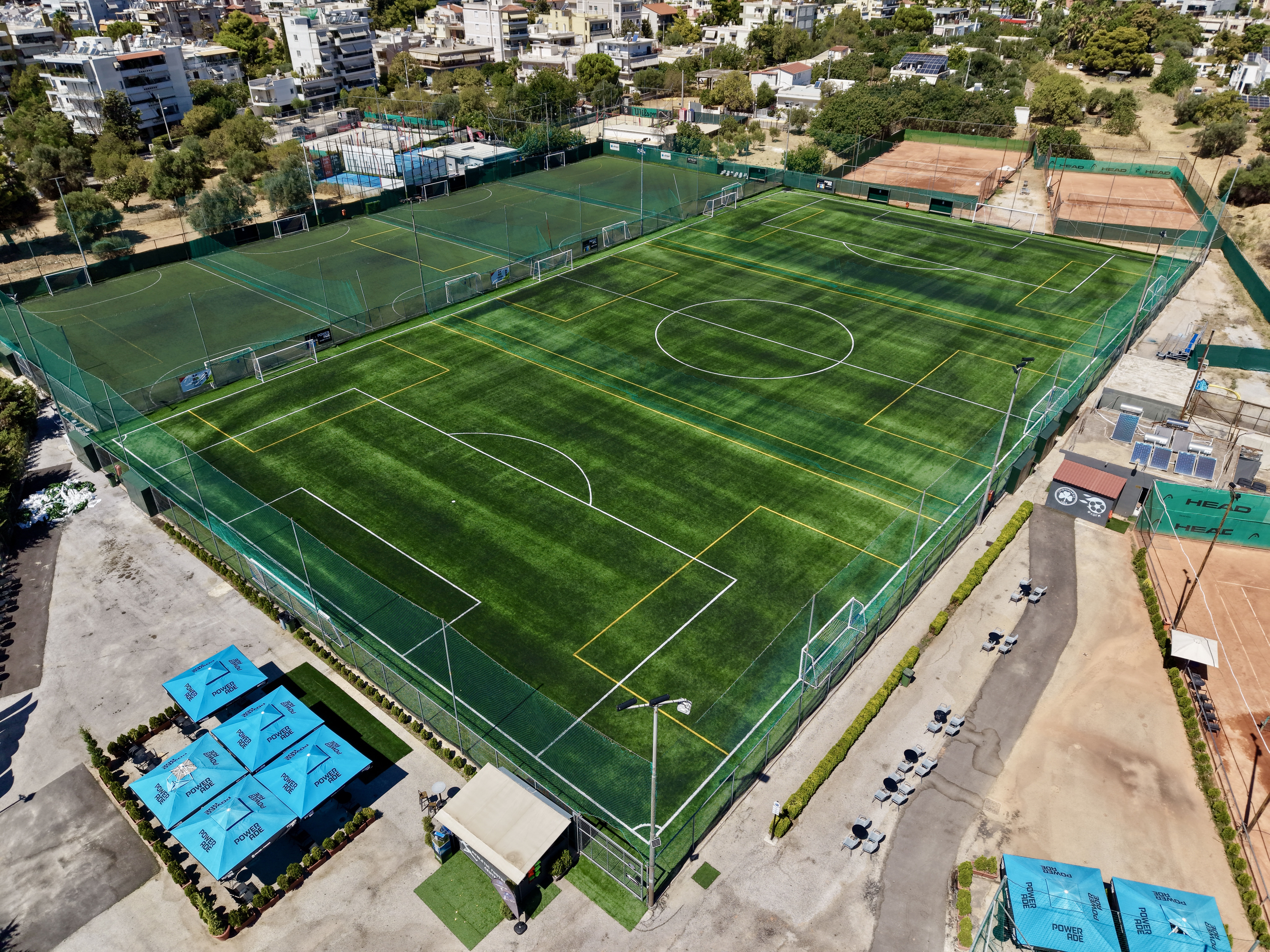 Aerial view — football pitches at dusk