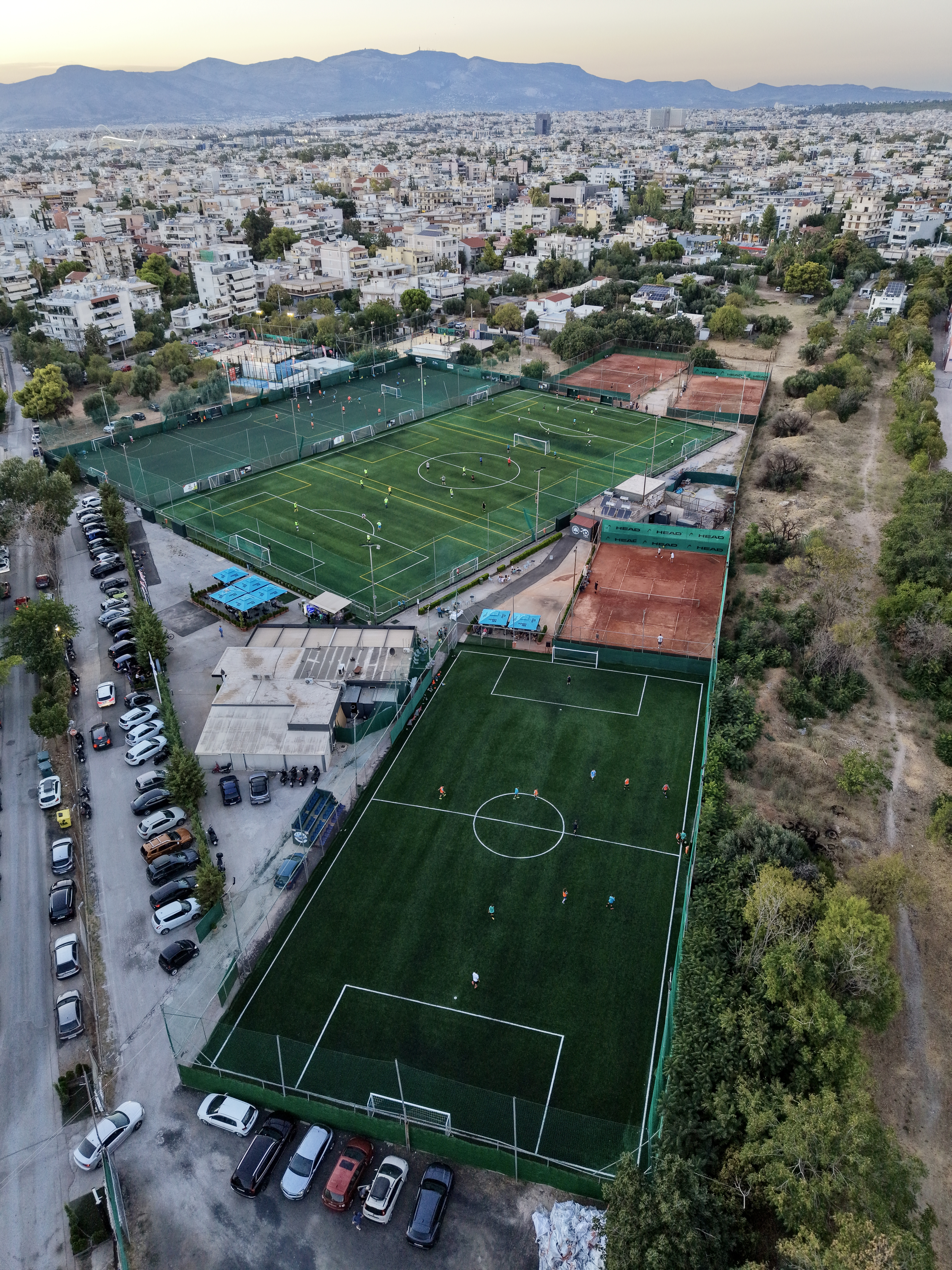 Aerial night view — illuminated pitches